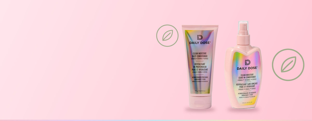 Daily Dose Clean Moisture Deep Conditioner and Leave-In Conditioner on a pink background