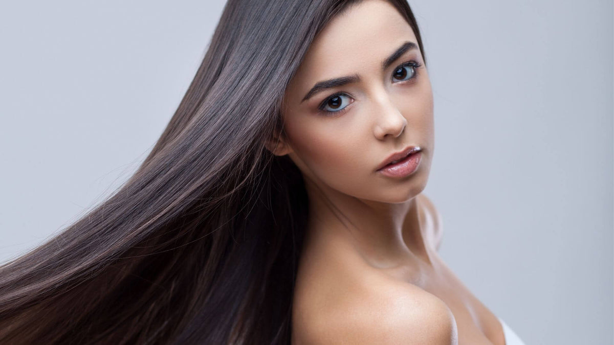 woman with sleek shiny brunette hair