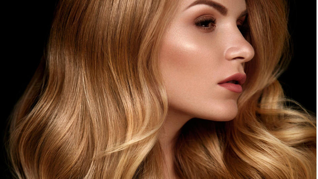 woman with sleek blonde wavy hair