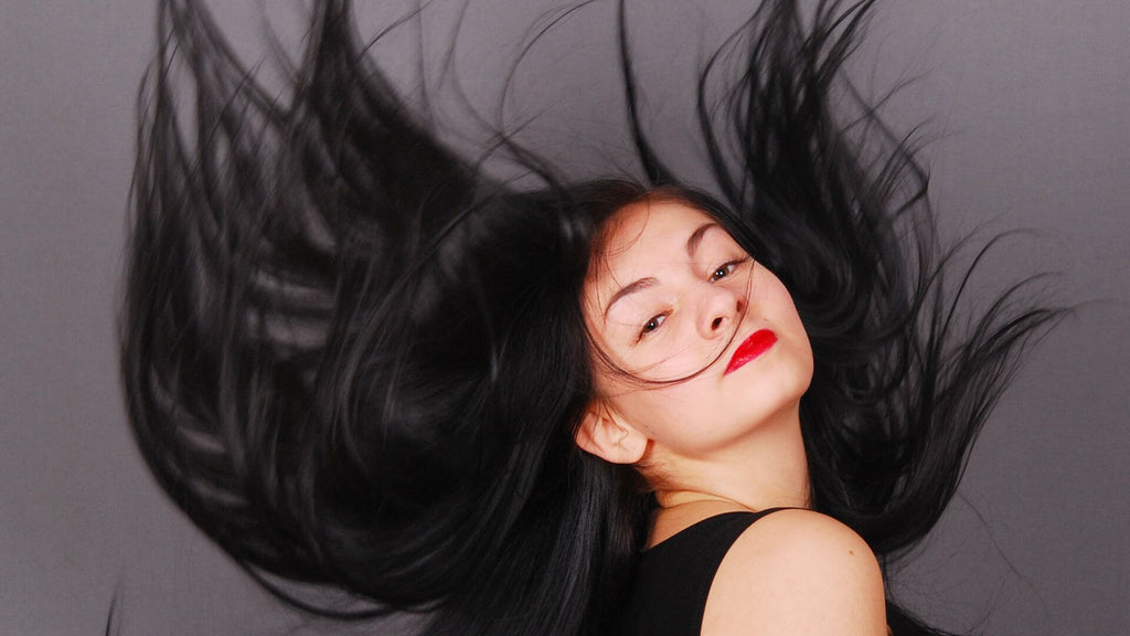 woman with long black hair in air