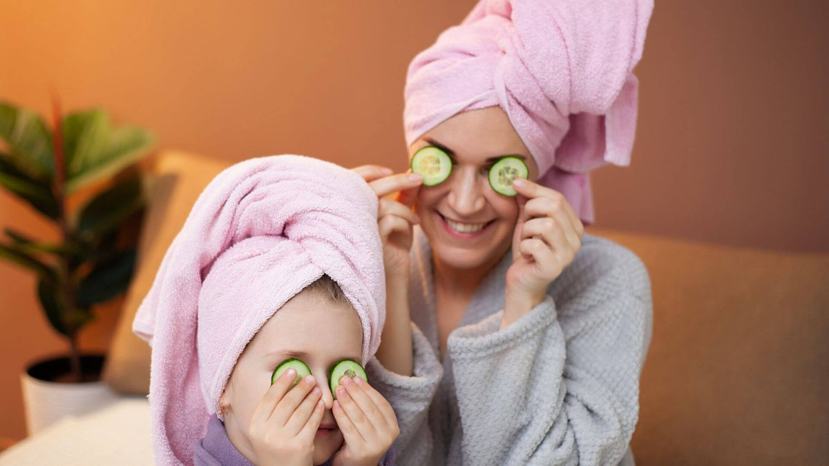 woman and child with cucumbers on eyes