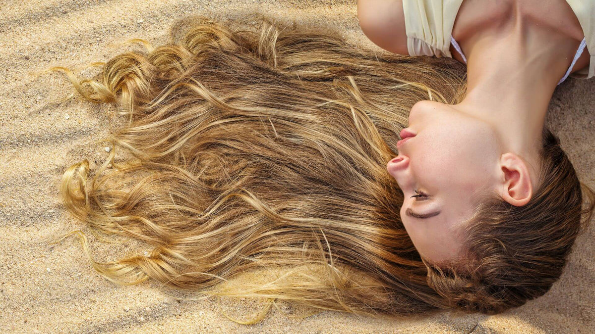 woman with blonde hair on beach