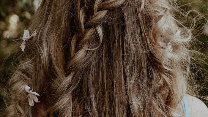 brunette hair with braids and flowers