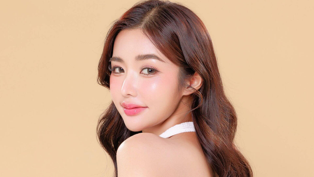 woman with wavy hair yellow background
