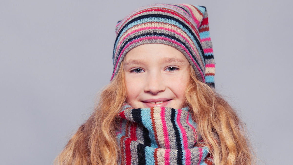 kid with red hair hat and scarf