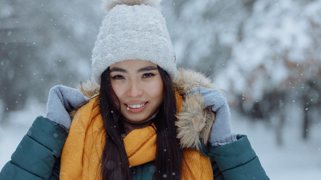 woman with yellow scarf in snow