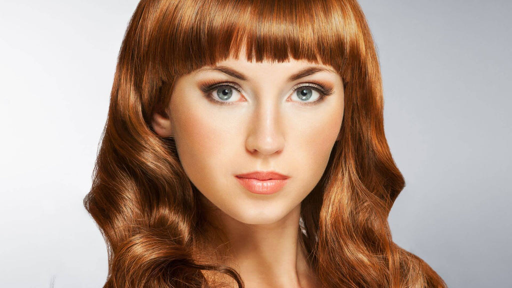 woman with red shiny hair bangs