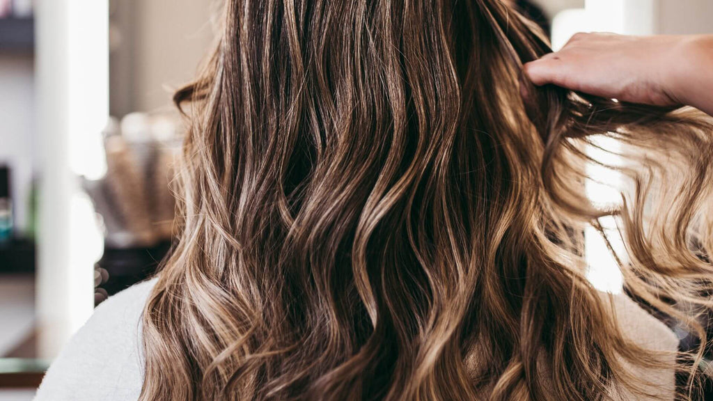 woman with curly wavy brunette hair