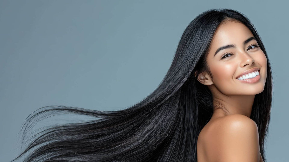 woman with sleek brunette hair blue background