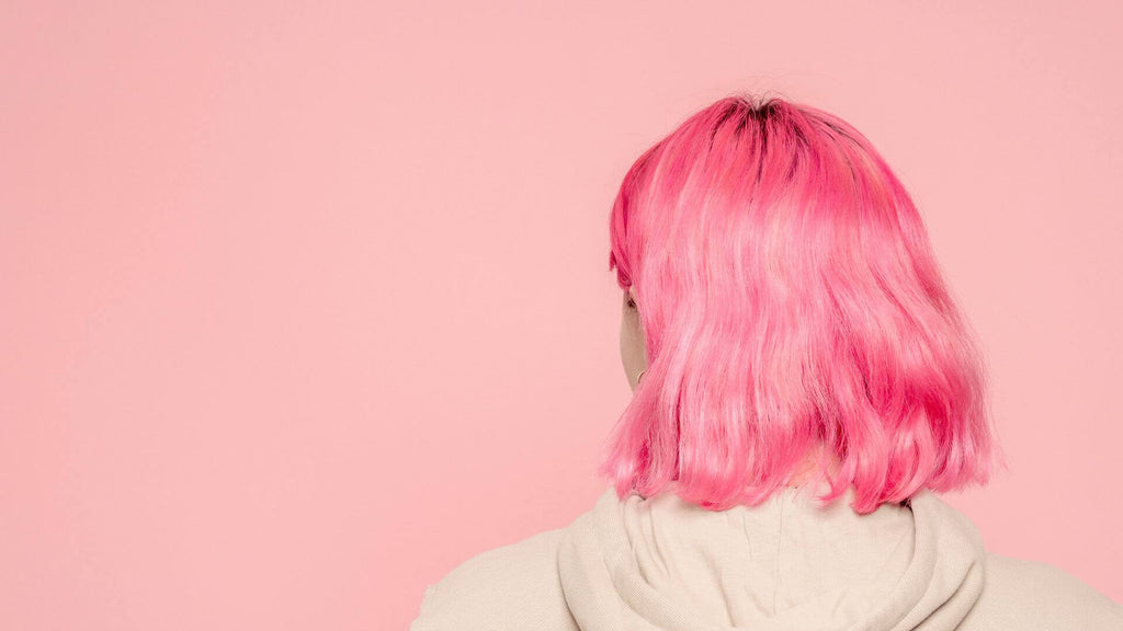 woman with pink hair and pink background