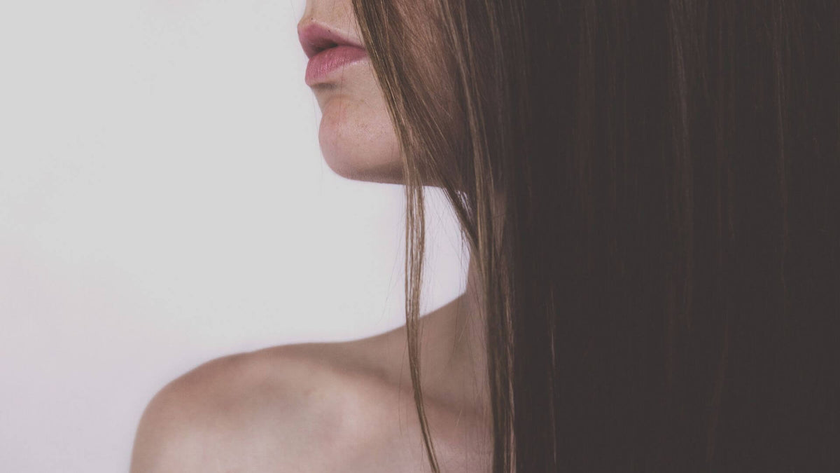 woman looking over shoulder brunette hair