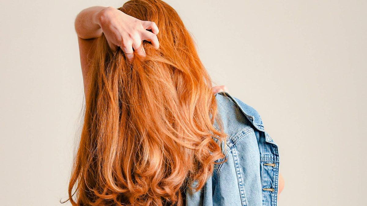 red head hand in hair