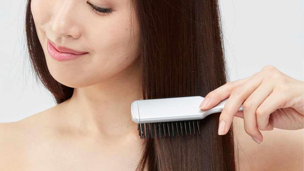 brunette woman brushing hair