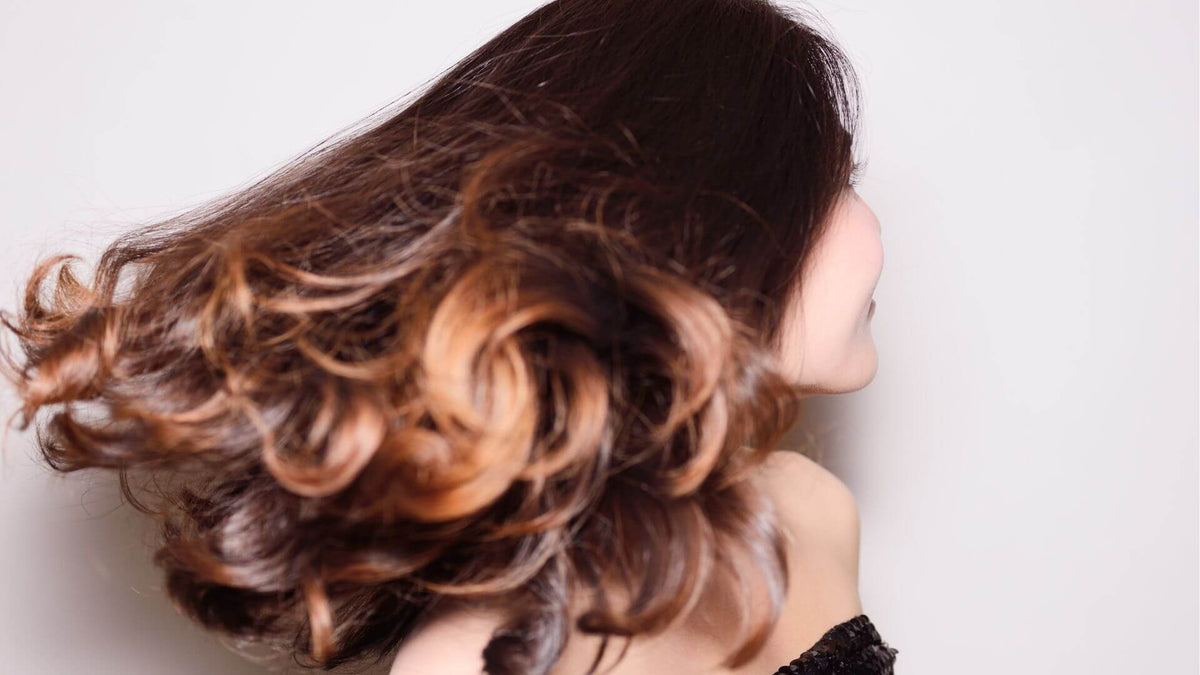 woman with brunette curly hair