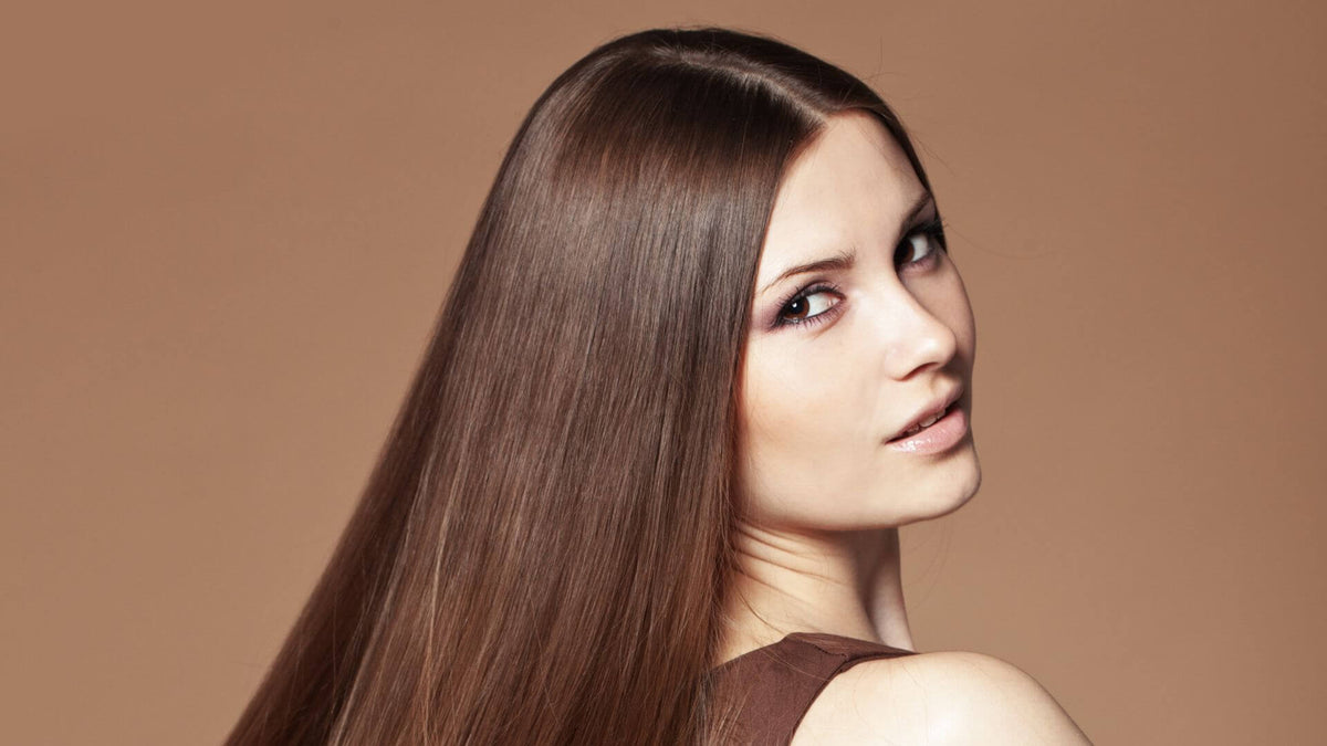 woman with sleek brunette straight hair