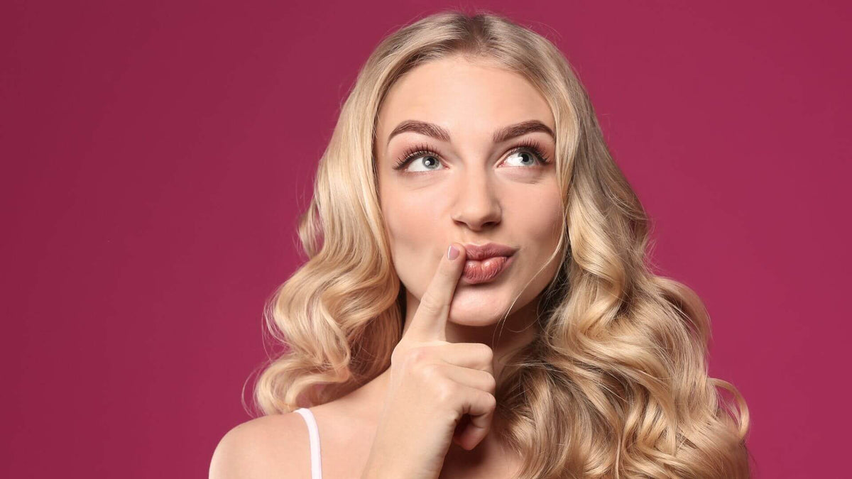 blonde woman pink background