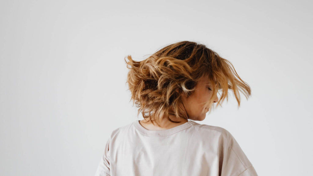 woman with short brunette blonde bob