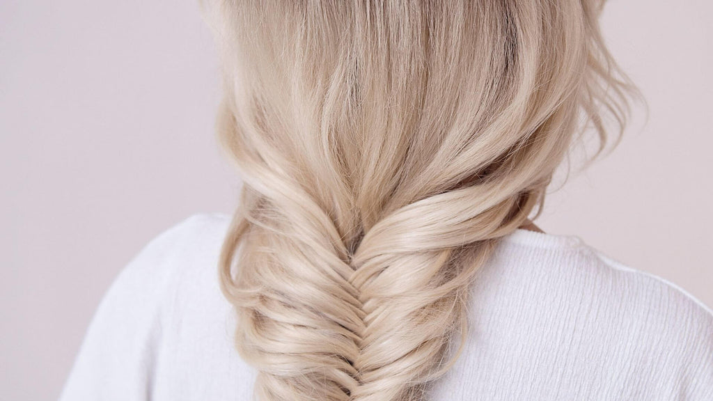 blonde braid pink background