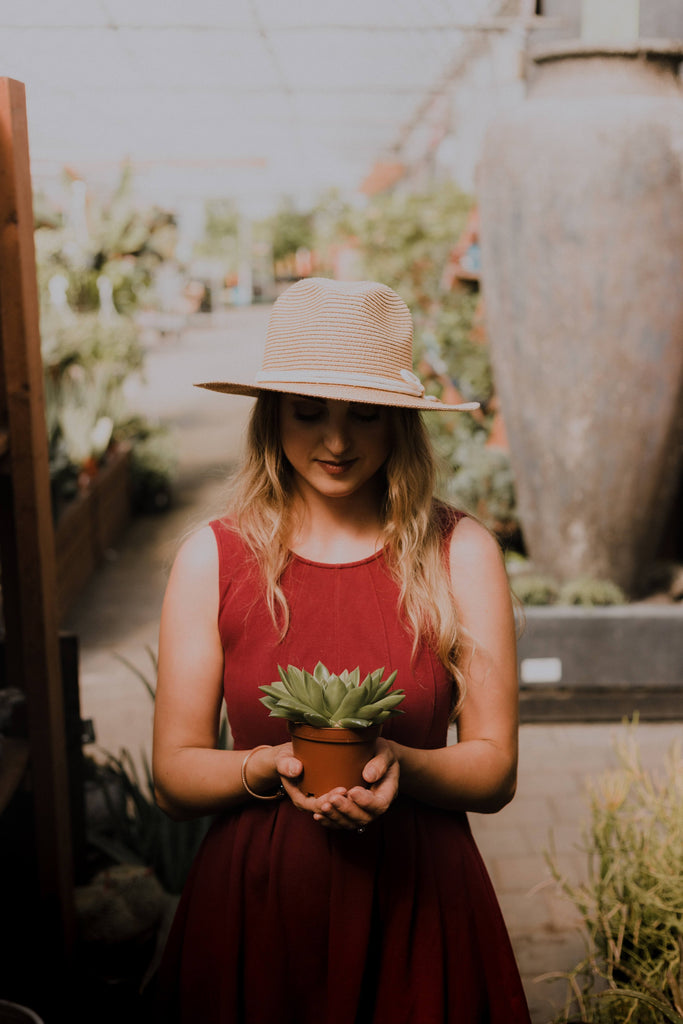 image of women with long hair and plant 