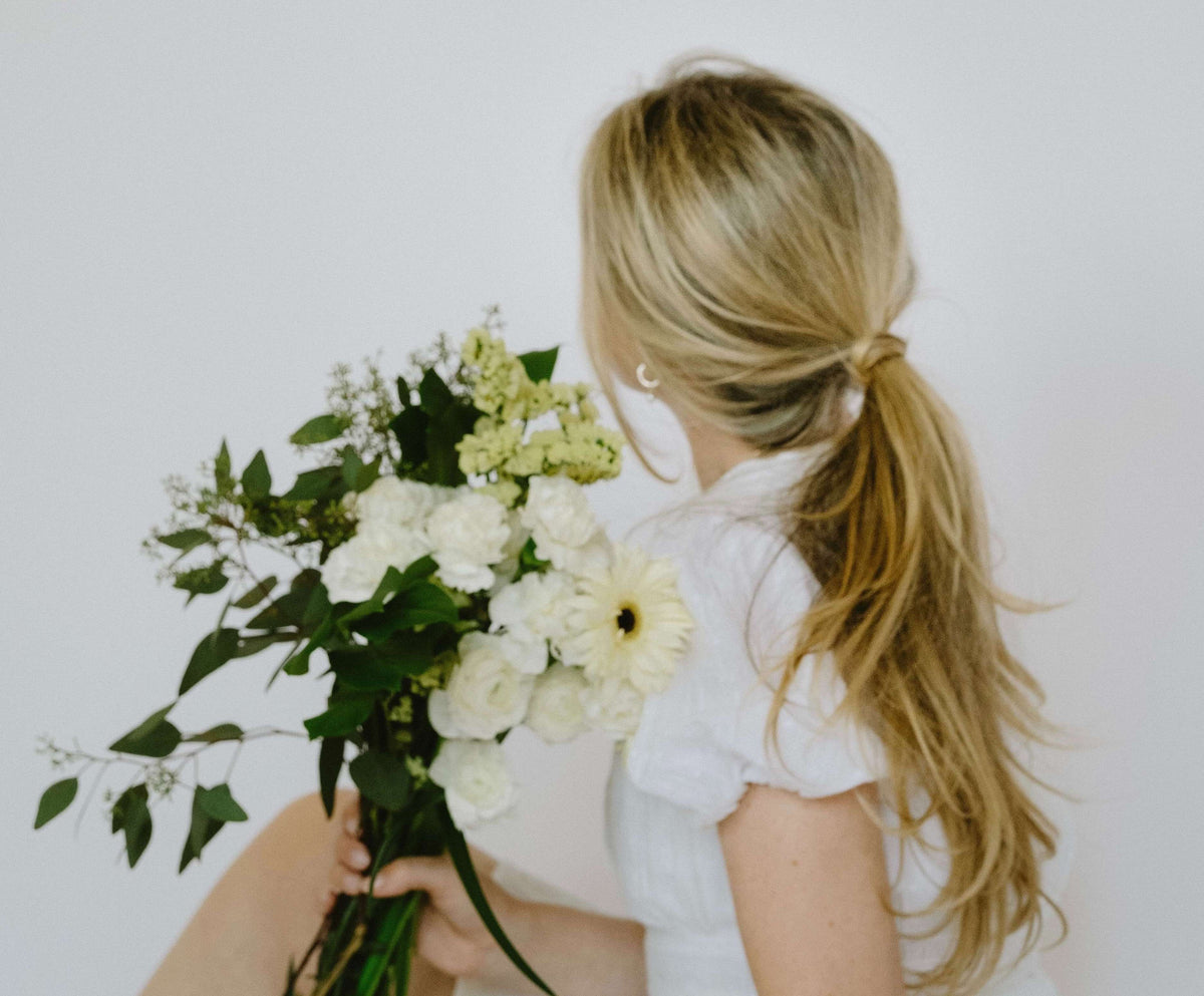 blonde woman with flowers