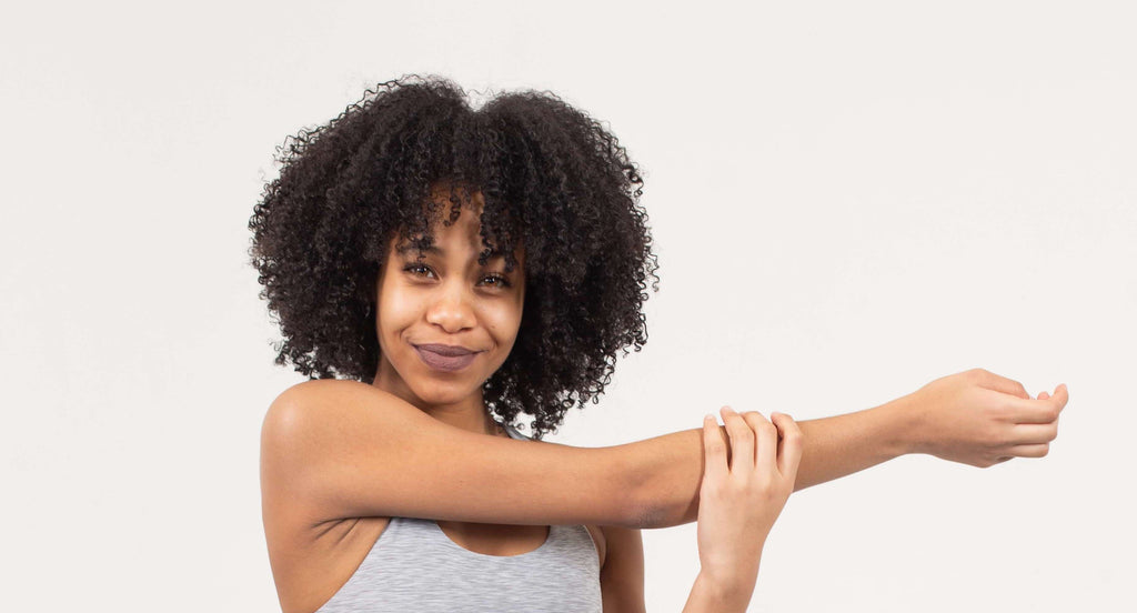 woman stretching arm