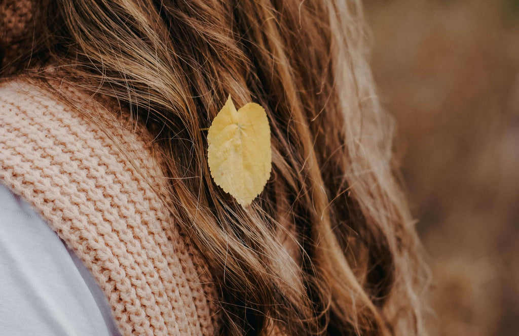 brunette curled hair with leaf 