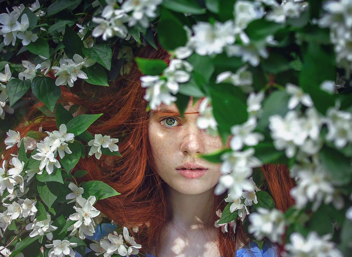 red hair woman in flowers