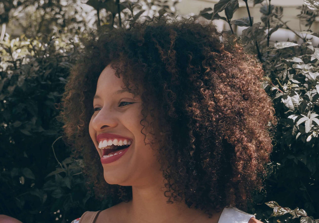 laughing woman tight curls