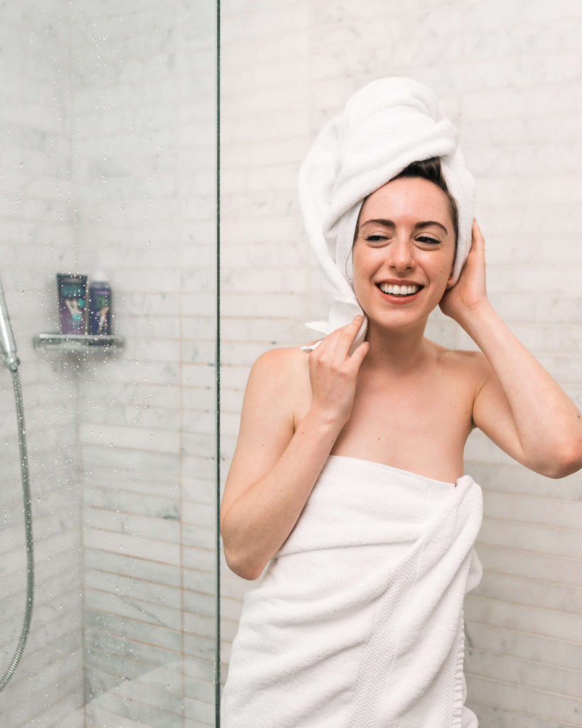 how to hydrate your hair - woman in shower hair